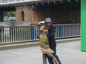Street performer by London Eye